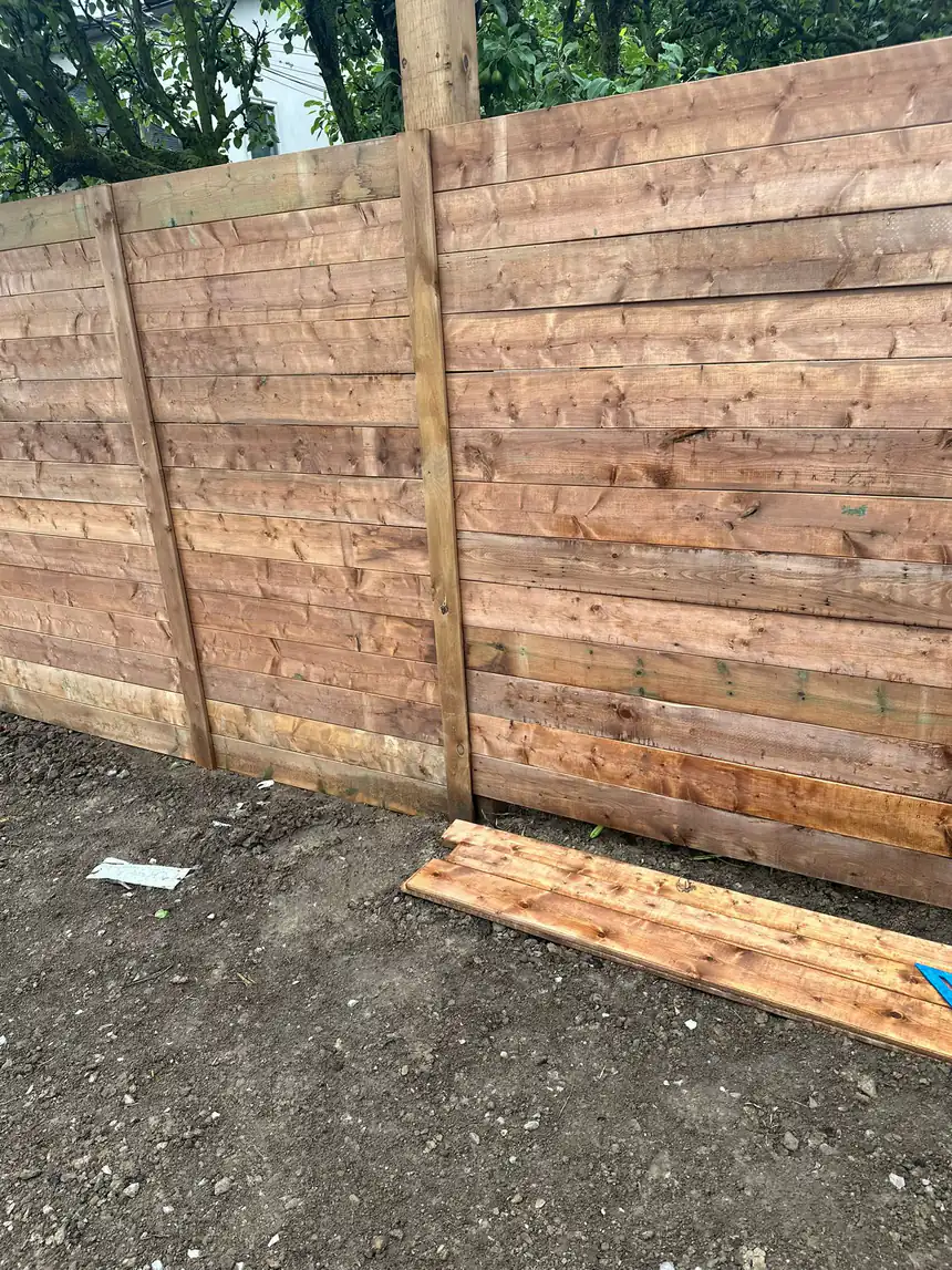 Custom cedar privacy fence build by World Gate Landscaping